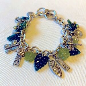 Cookie Lee silver and green toggle charm bracelet.